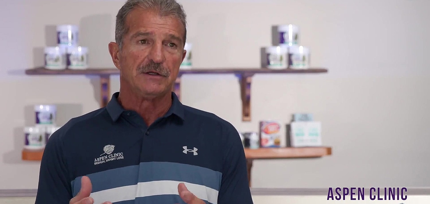 Man discussing health at Aspen Clinic.